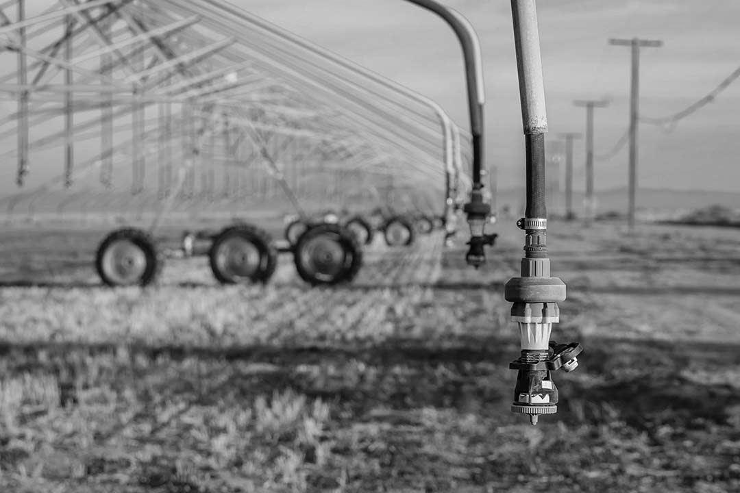 black and white image of large industrial crop spray machine 