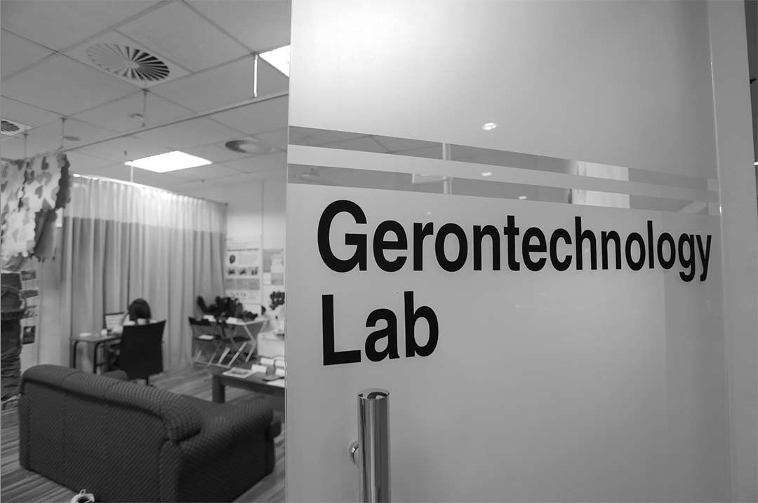 black and white image of a gerontechnology lab glass door 