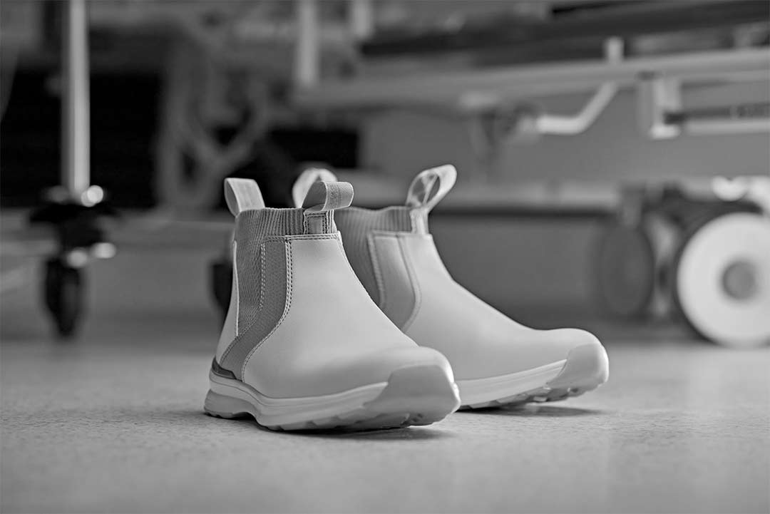 black and white close up photo of modern medical boots in a hospital scene