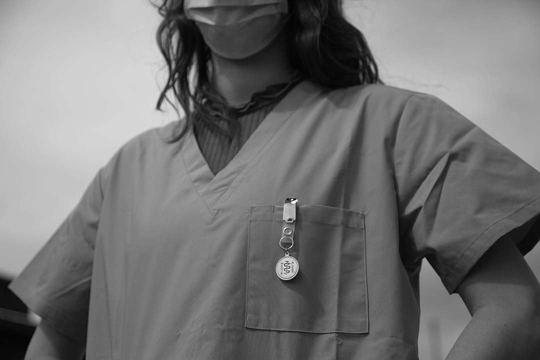 black and white image of a nurse with a mask on