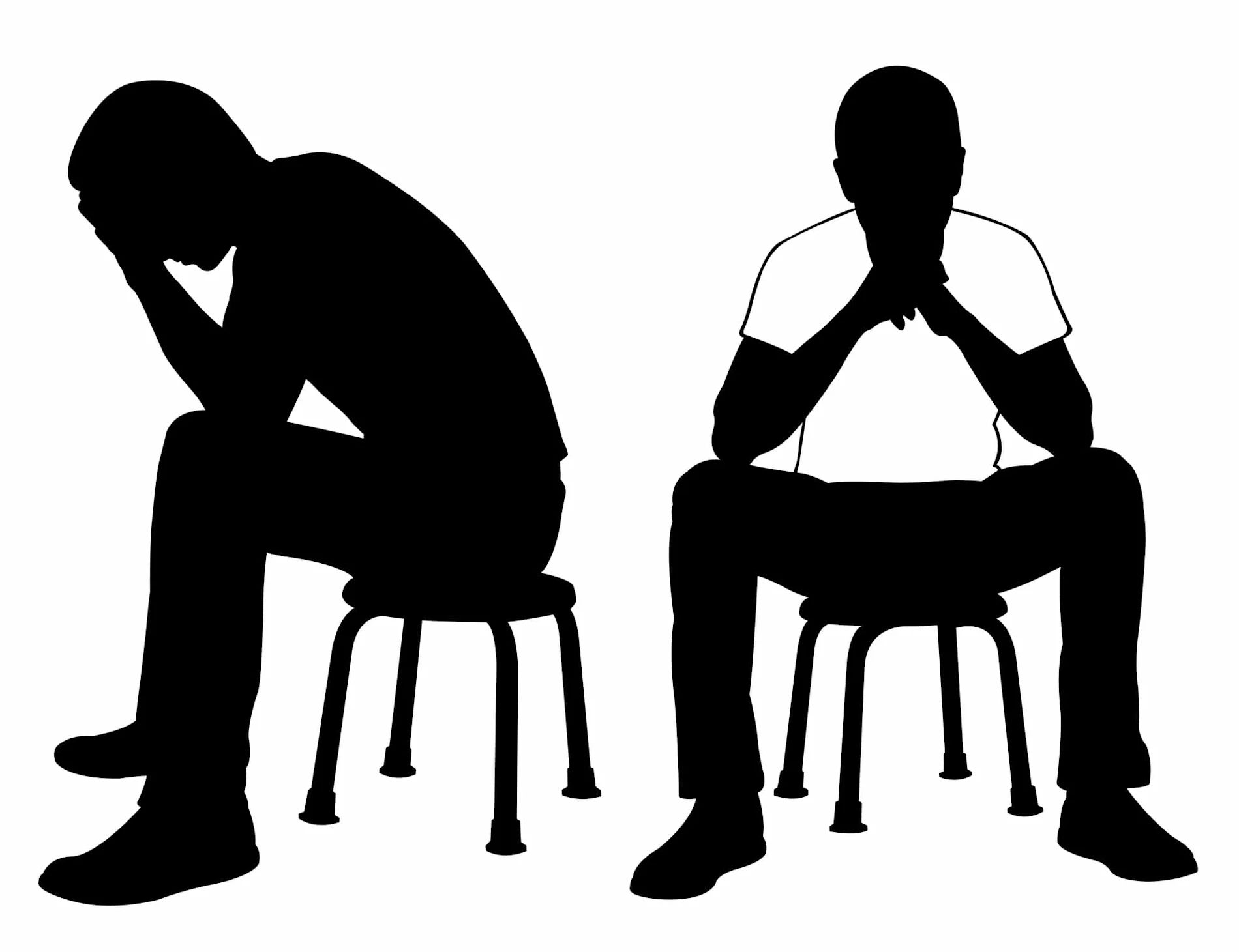Silhouette of two men sitting on stools contemplatively